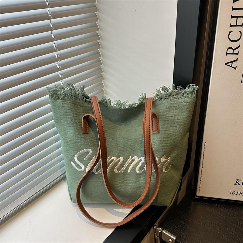 New Letter Tassel Canvas Bag Women's Versatile Largecapacity Simple Commuter Student Shoulder Tote Bag