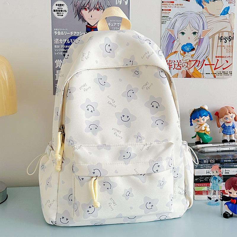 Nowy tornister jest wysokiej jakości, świeży, słodki i uroczy, a plecak w gwiazdki to lekki plecak podróżny dla uczniów gimnazjum.