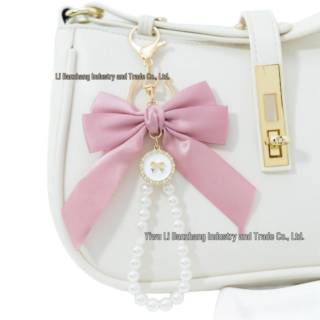 Large Bow Faux Pearl Bracelet Keychain with Colored Woven Strap and Alloy Tag Pendant