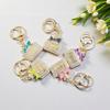 Radiant Bow Perfume Bottle Keychain & Elegant Bag Pendant Gift