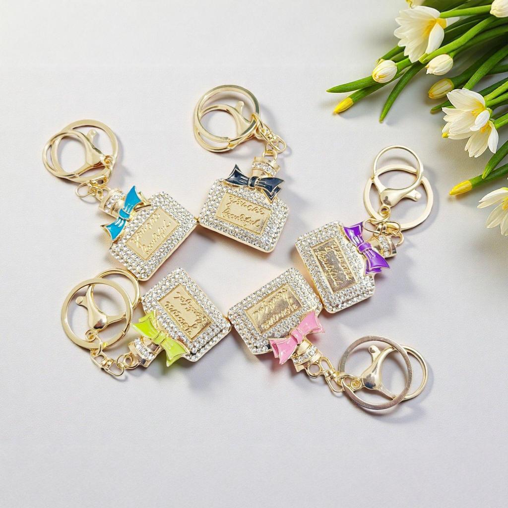 Radiant Bow Perfume Bottle Keychain & Elegant Bag Pendant Gift