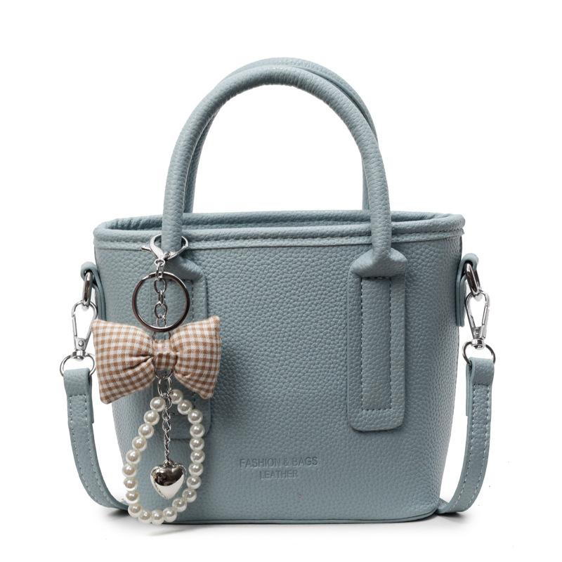 Spring and summer popular solid color simple high quality lychee pattern portable bucket bag women's fashion versatile commuter messenger bag