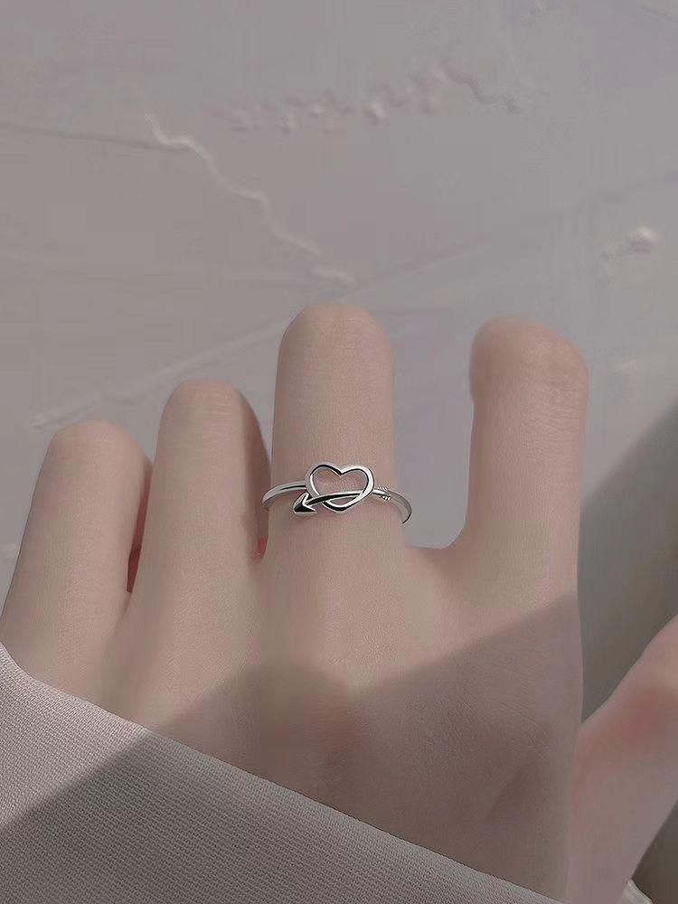 Elegant Heart-Piercing Ring for Women - Stylish Hollow Heart Design, Perfect for Engagement or Everyday Wear.