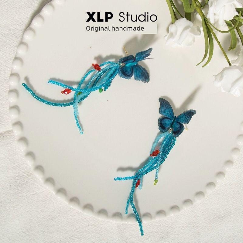 

XLP Studio Blue Long Fringe Earrings Spring Fairy Butterfly Stud Earrings Niche Style Unique Silver Needle Beaded Earrings Butterfly earrings A pair