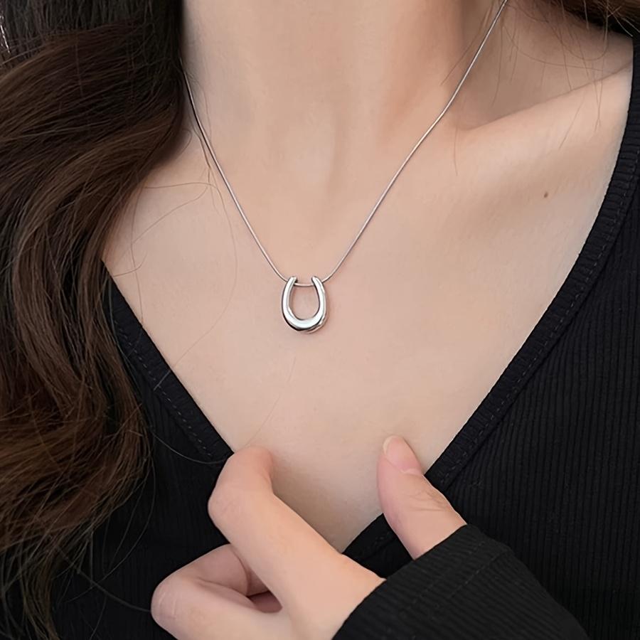 A vintage stainless steel necklace with a U-shaped pendant, symbolizing good fortune, is the perfect choice for women s chain jewelry.