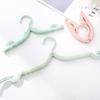 Portable Folding Non-Slip Hanger for Adults & Children - Multifunctional, Retractable, Traceless Design for Travel & Home Use.