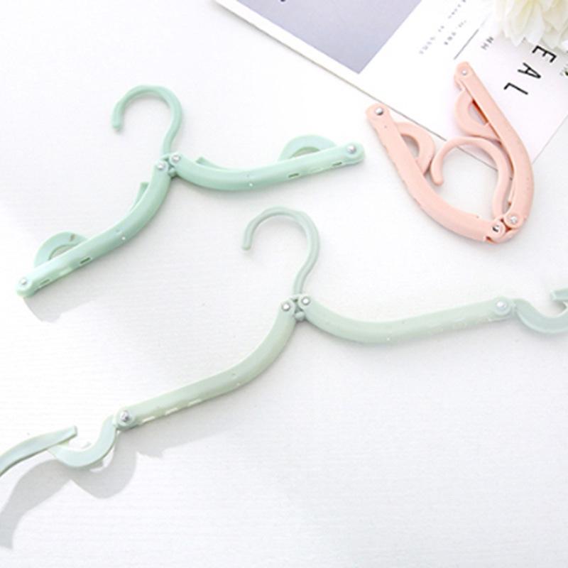 Portable Folding Non-Slip Hanger for Adults & Children - Multifunctional, Retractable, Traceless Design for Travel & Home Use.
