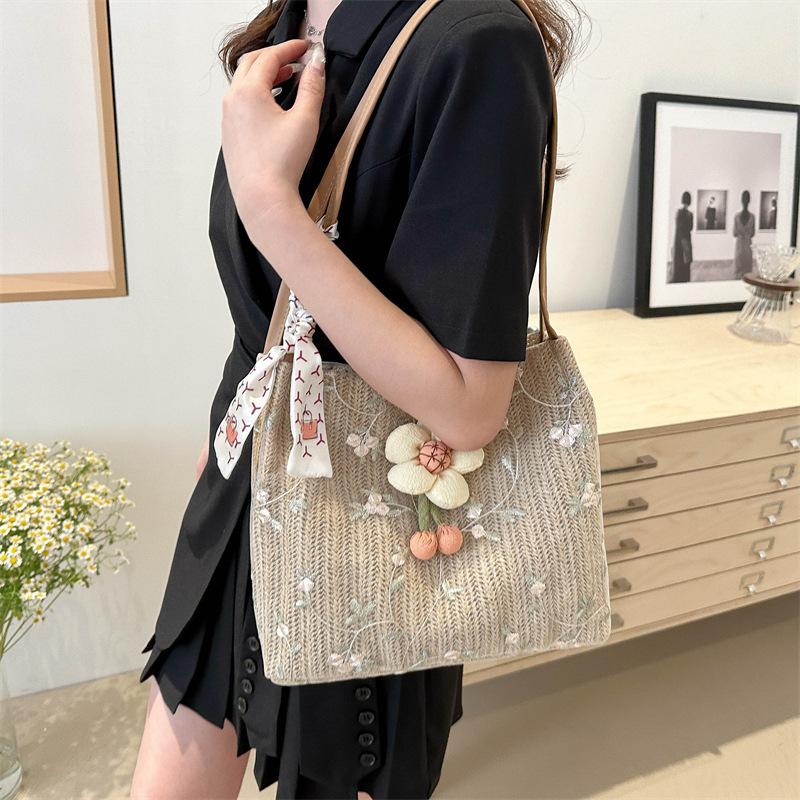 Niche Knitted Bucket Bag New Style Class Commuter Tote Bag for Women Large Capacity Vacation One Shoulder Straw Woven Bag