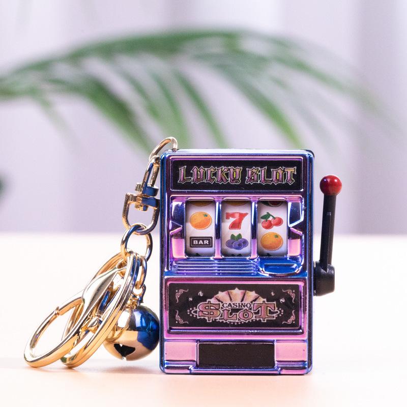 Gold-Plated Creative Tiger Fruit Machine Keychain Toy with Lottery Play Feature