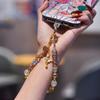 Light luxury crystal mobile phone chain fashion butterfly pendant mobile phone lanyard gold foil handmade beaded short wrist lanyard
