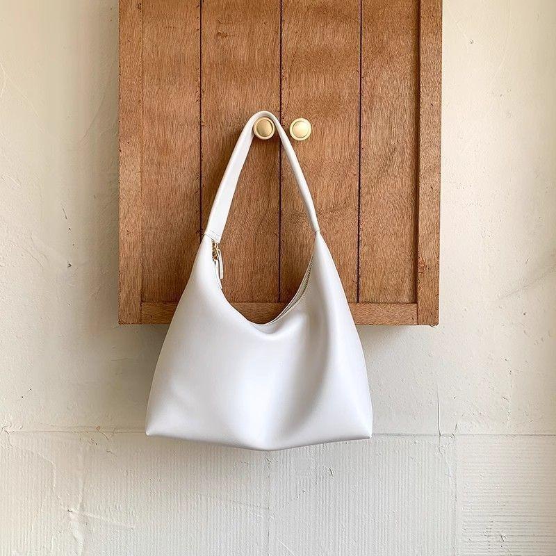 ins simple and versatile milk tea color bag gentle wind Korean portable soft leather dumpling bag retro shoulder armpit bag