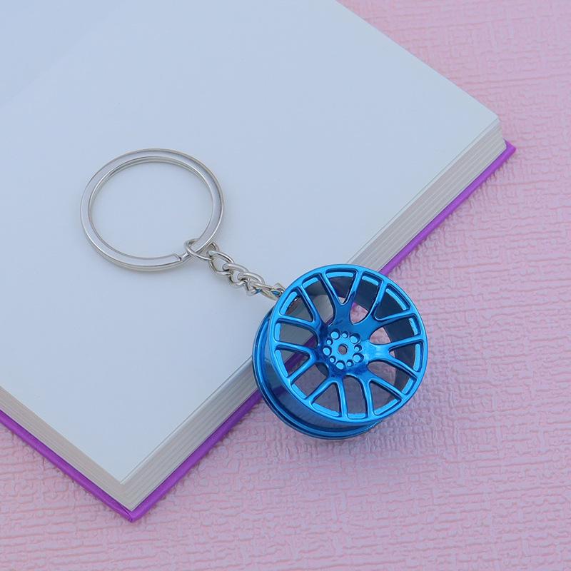 Creative Car Wheel Hub Keychain: Zinc Alloy Metal, Customizable Gift.