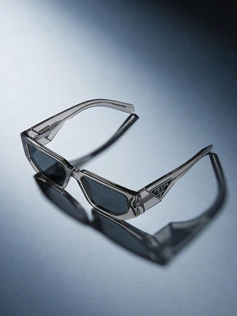 Prada PR09ZS Transparent Grey Sunglasses, Modern UV400 Shades with Triangle Logo