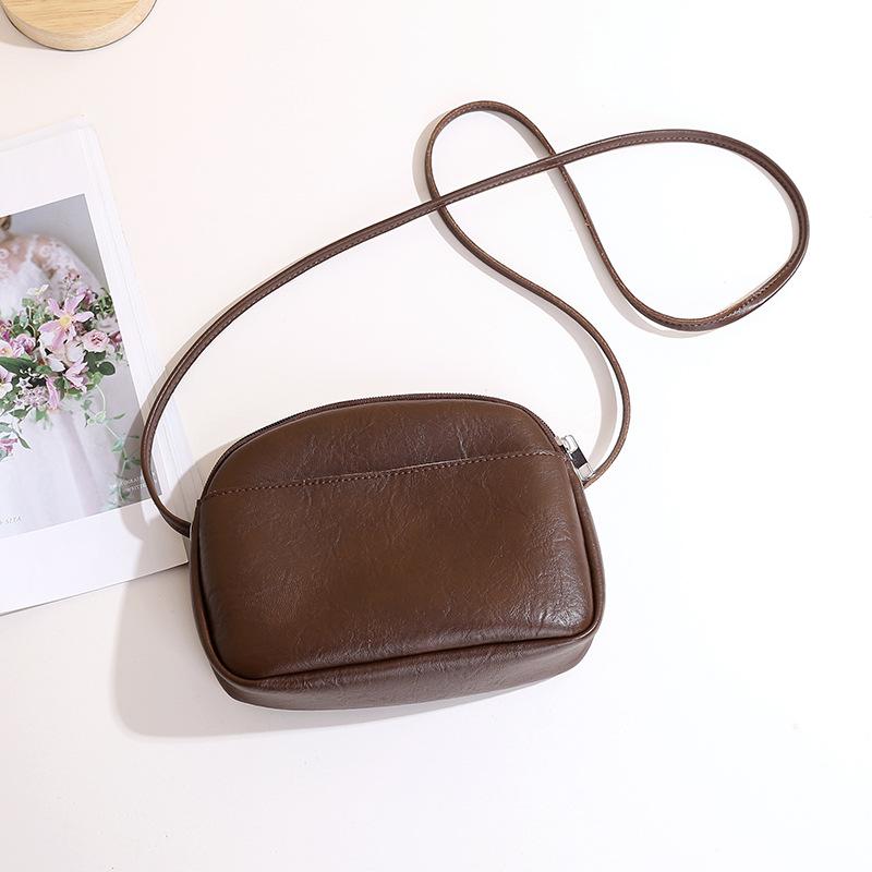 Retro women's simple soft pu leather small round bag solid color new style zip single-shoulder crossbody small bag daily handbag