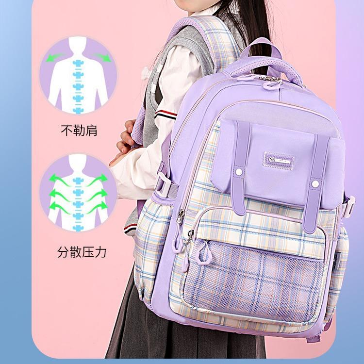 New schoolbag for primary school students, plaid load-reducing ridge backpack, anti-splashing water and wear-resistant canvas backpack, fashionable.