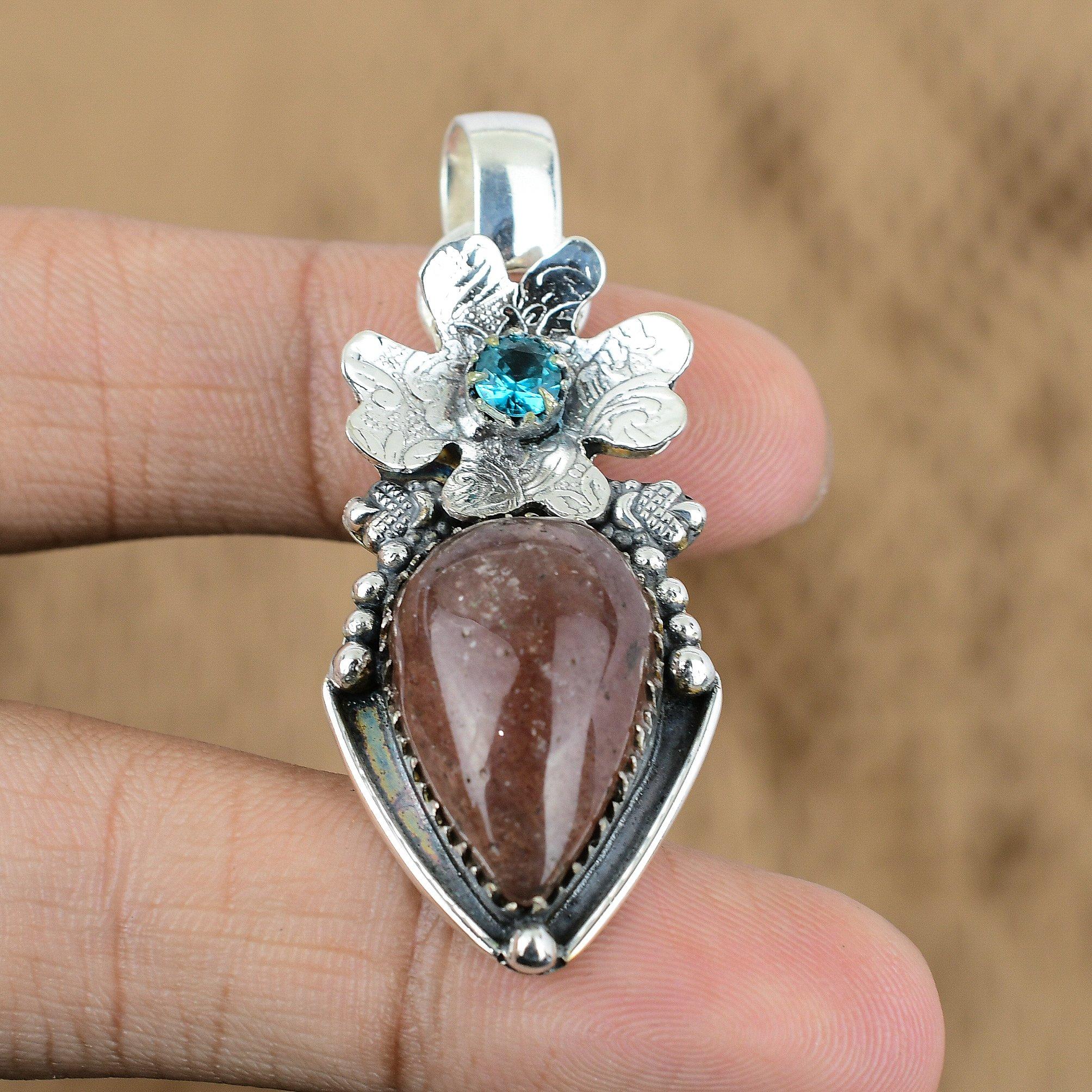 

Sterling Silver Sunstone Gemstone Swiss Blue Topaz Flower Sacral Chakra Pendant