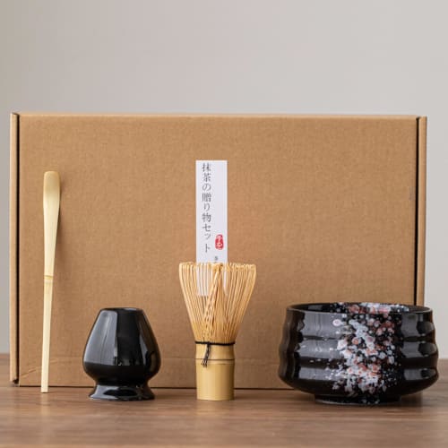 This 4-piece tea ceremony set includes a tea whisk, a 100-piece tea whisk holder, a straightening tool, a tea scoop, and a matcha bowl. It's compact a