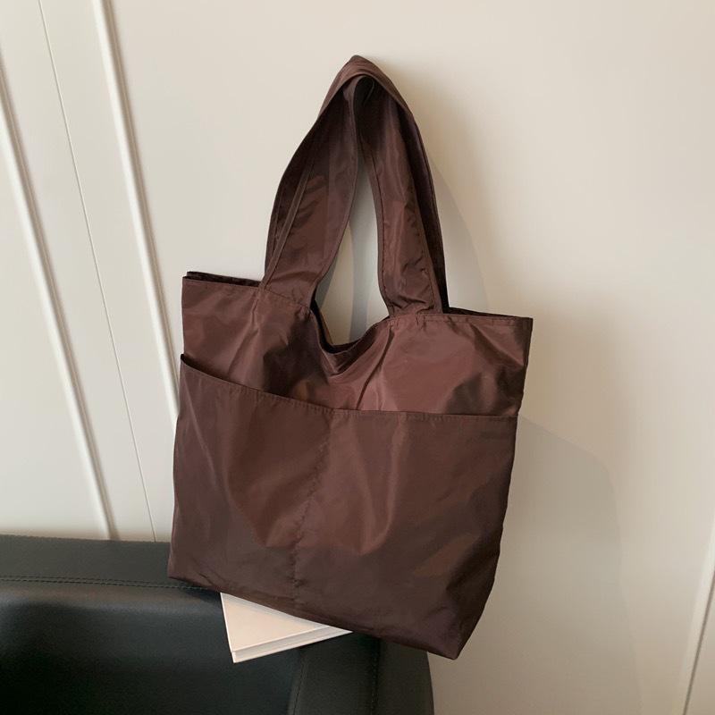 European-American Fashion Large Capacity Travel Bag - Solid Color, Nylon, Handheld or Shoulder Style for Women