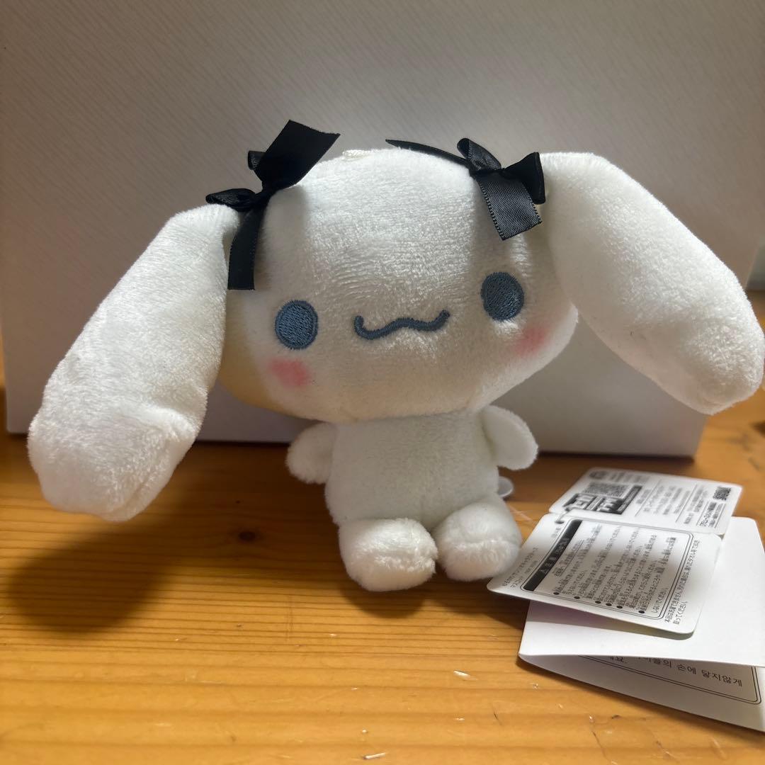white rabbit plush toy with ribbon
