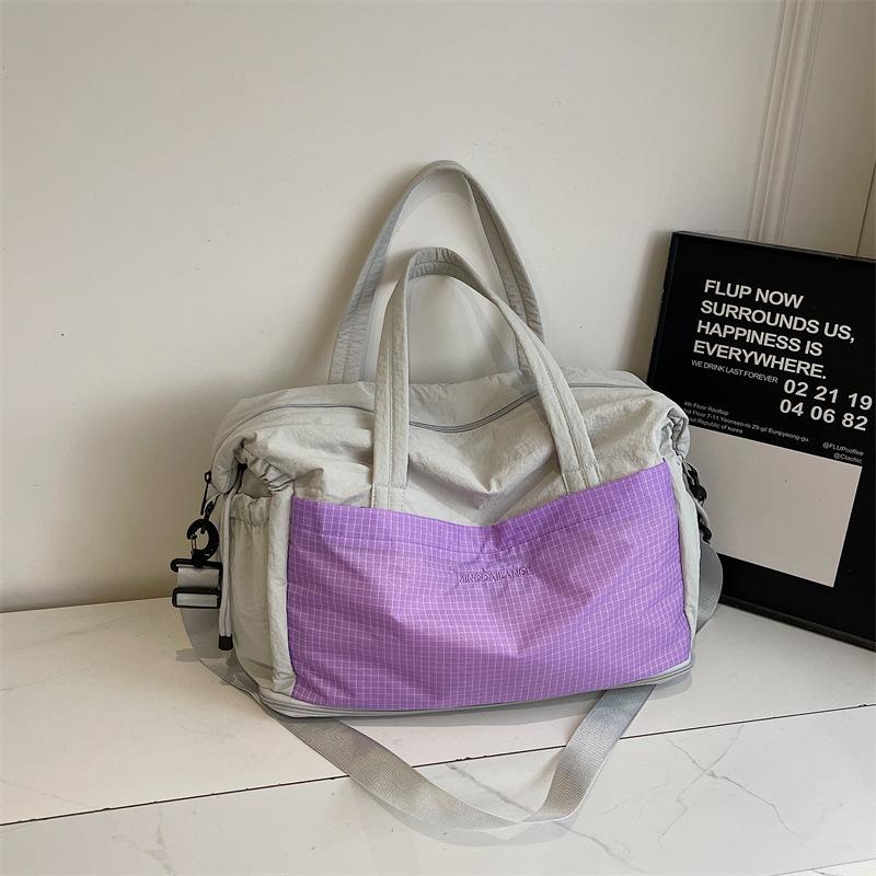 

Европейские и американские модные дорожные сумки 2025 осень новые сумки-тоут большой вместимости нишевые повседневные в иностранном стиле лоскутные сумки-мессенджеры фиолетовый