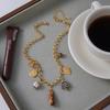 Youthway Resin Tiger Eye Stone Ceramic Flower Portrait Coin Pendant Necklace For Women 18K Gold Plated Stainless Steel Necklace