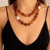 Stylish Red Resin Irregular Bead Necklace With Adjustable Length For Personalized Fit And Artistic Design In Sturdy Alloy Construction.