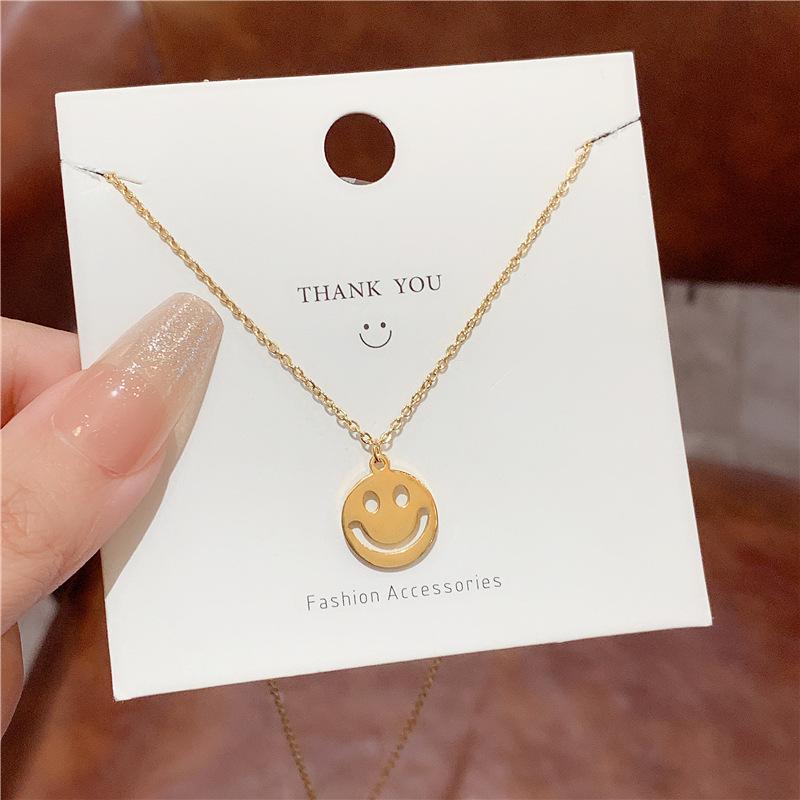 Cute cartoon pendant hollow smiley face expression necklace female simple versatile titanium steel collarbone chain