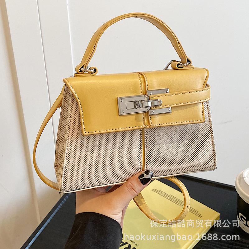 Korean version of high-quality, simple and versatile commuter handbag women's 2025 summer new niche messenger small square bag