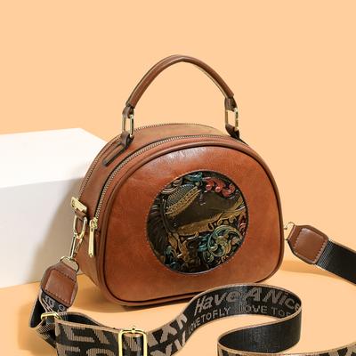 Runde Umhängetasche mit Printmuster und Stickerei Stilvolle Crossbody-Tasche für Mode und den täglichen Gebrauch