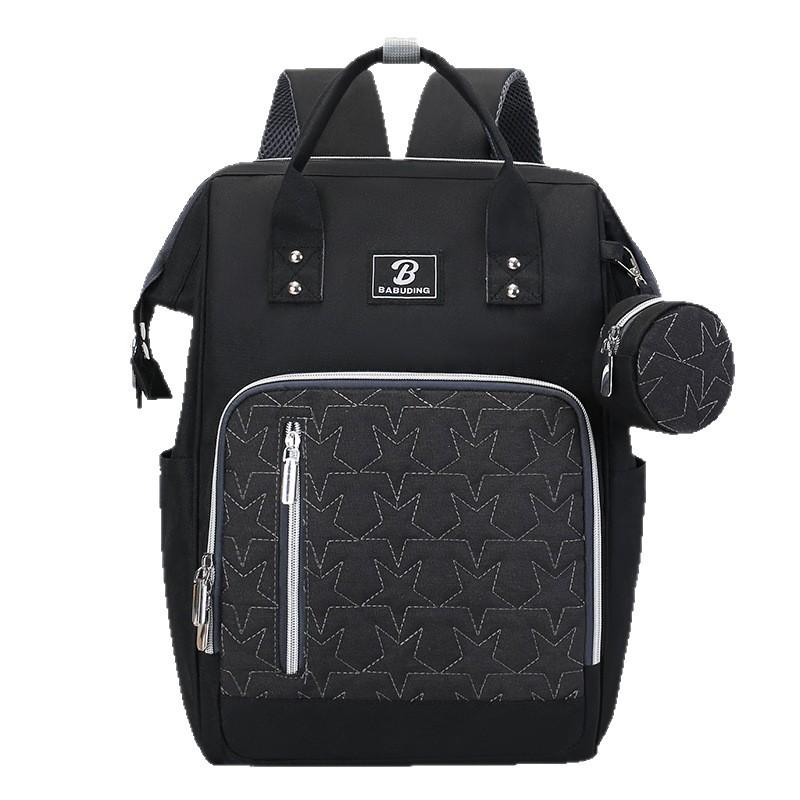 New style mommy bag with large capacity, featuring a patchwork design, contrasting colors, and a versatile, fashionable look. It’s a waterproof