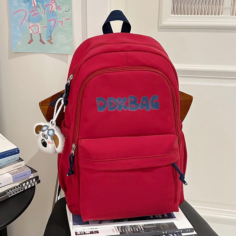 

College student schoolbag female simple solid color letter backpack Japanese casual male high school student large capacity travel backpack single bag красный