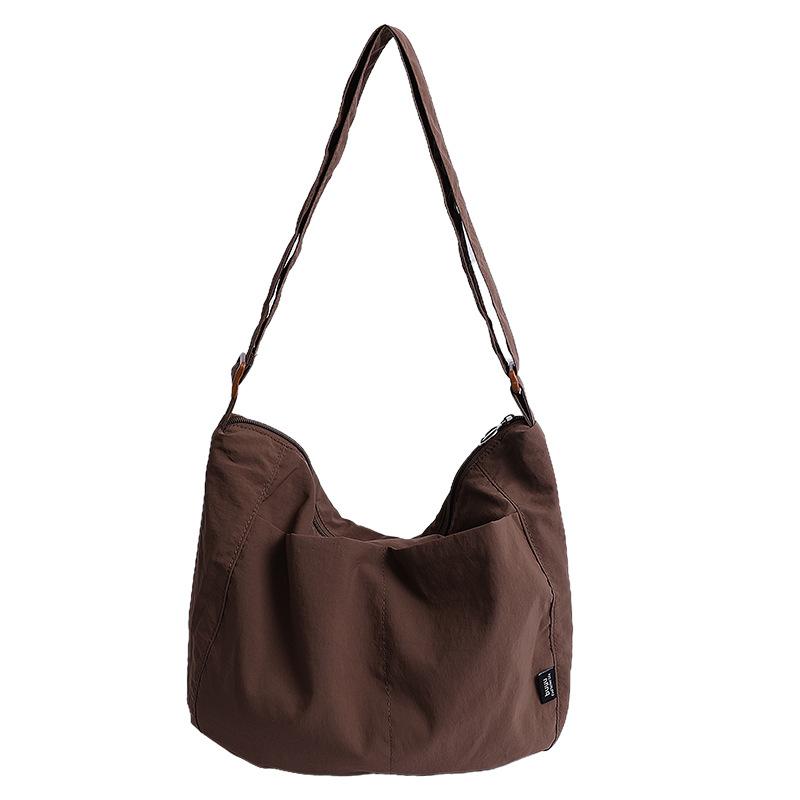 

Canvas multi-pocket bag women s large-capacity new versatile shoulder messenger bag class commuter tote bag