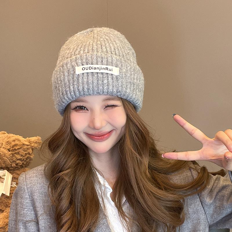 

Autumn and winter white face small ear protection hat Korean version fashion big head knitted hat