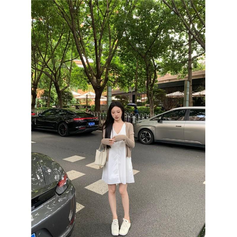 Women's Stylish V-Neck Sleeveless Summer Dress: Loose Fit, Slimming, Solid Color, Short Skirt - New Fashion Collection.