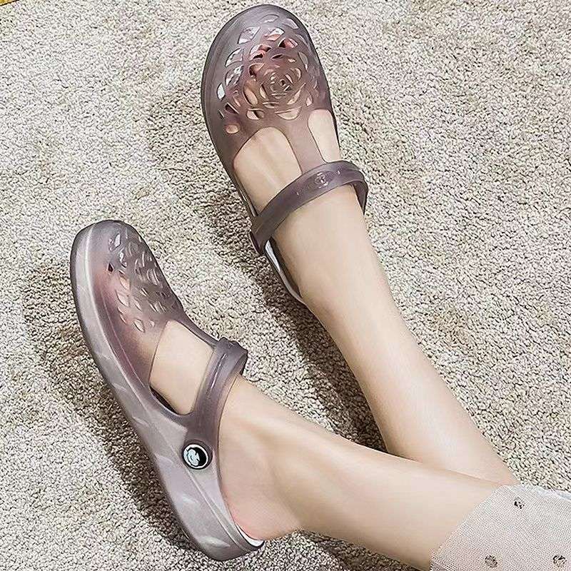 Buty z dziurami damskie lato nowe sandały galaretkowe wersja koreańska modne płaskie antypoślizgowe buty plażowe słodkie sandały uczennicy