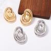 Retro elegant fashion spiral metal texture light luxury earrings niche high sense commuter vacation women