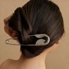 A Large Silvery Metal Hairpin, Suitable For Hairpin, Scarves, And Shawls As A Versatile Decorative Pin.