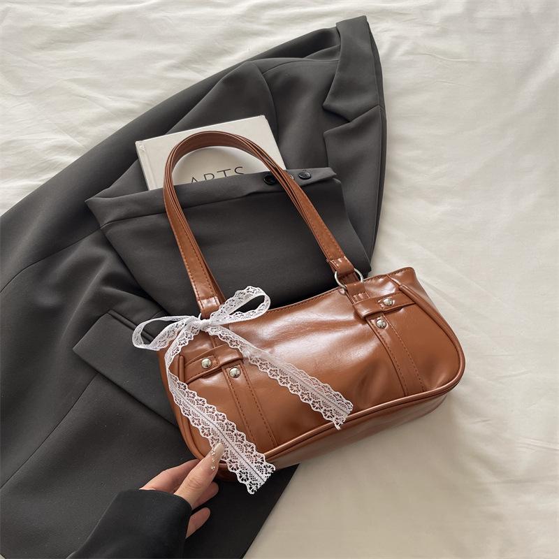 French niche bag women's new bow pillow bag shoulder messenger bag portable baguette bag