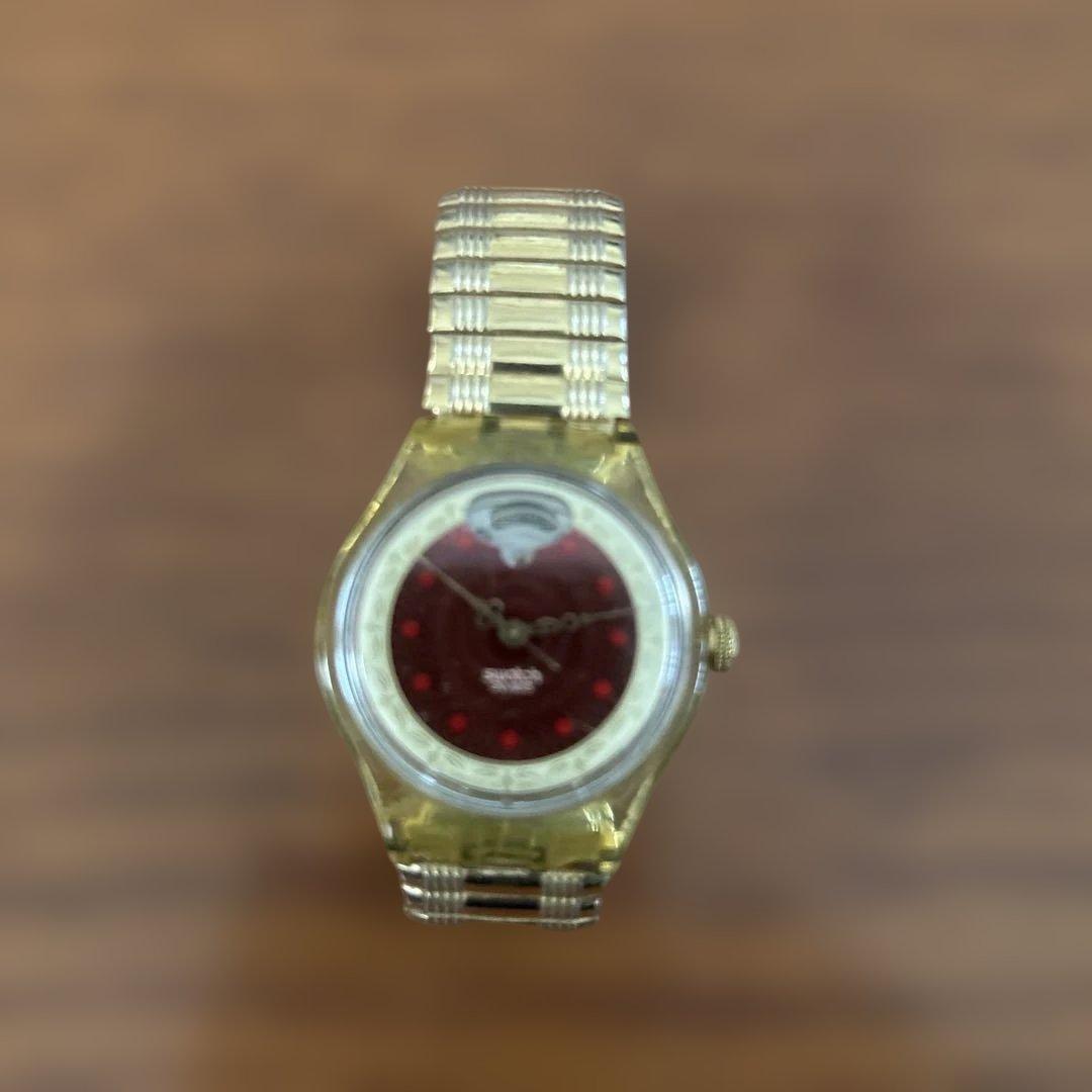 Used Swatch watch gold red