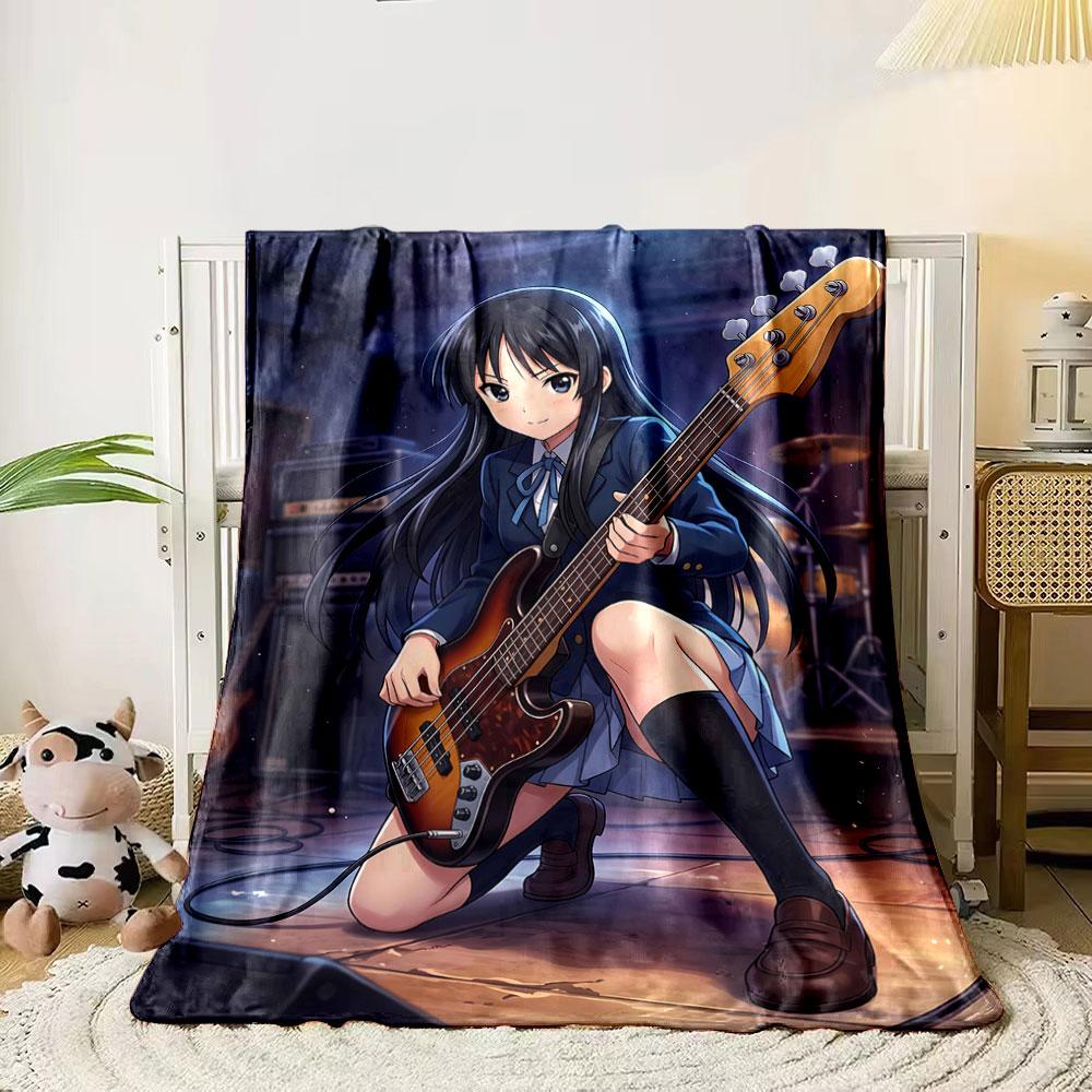 A girl in a school uniform playing a bass guitar on a stage. for all seasons blanket lunch break throw gift 80cm x 120cm