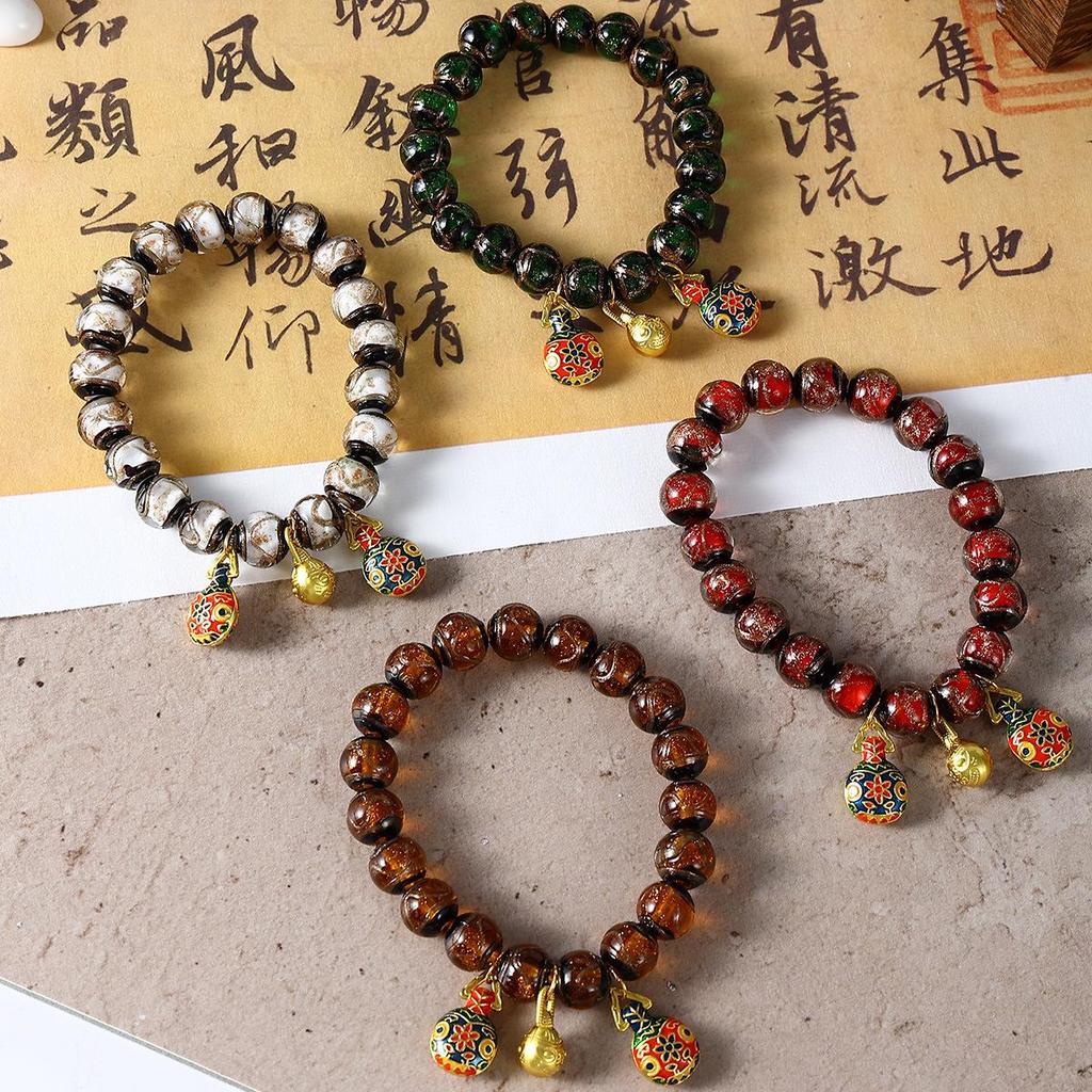 Aschgraues Pi Xiu Glasperlenarmband mit Blattgold und bunten Perlen