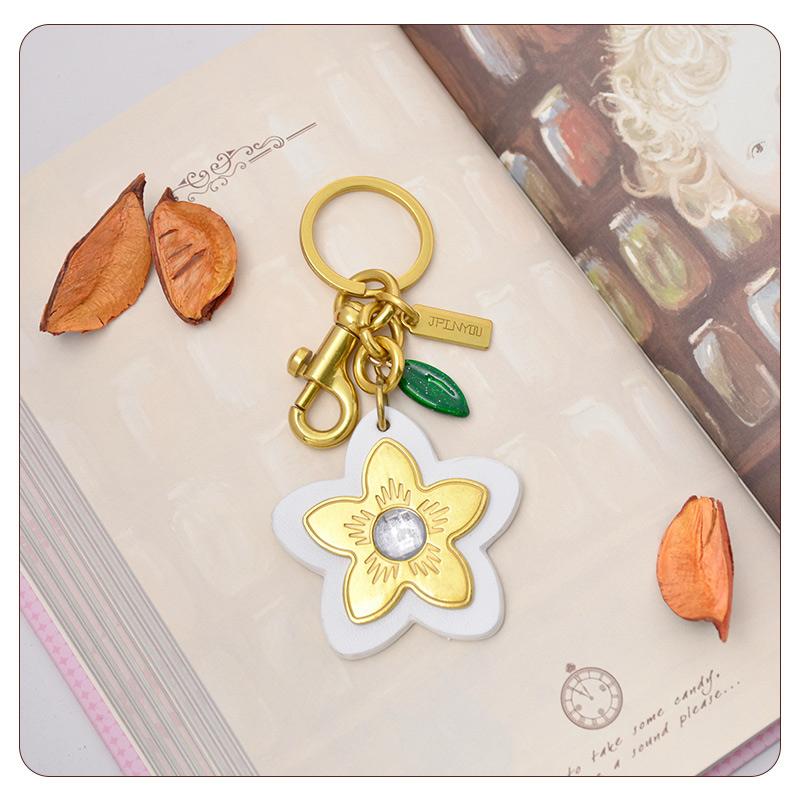 Marque de Luxe Sac Fleur Pendentif Mode Élégant Métal Cuir Créatif Exquis Polyvalent Mignon Accessoires Sac Porte-clés