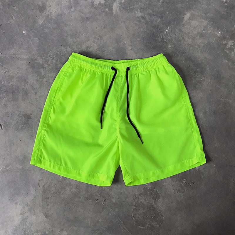 Letnie męskie spodenki casualowe Cukierkowe kolorowe spodnie Five Quarter męskie sportowe luźne szybkoschnące cienkie spodnie plażowe spodenki męskie