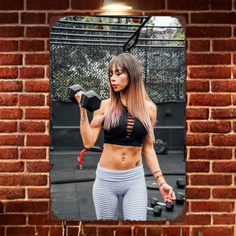 

HD Metal Tin Sign Strong Fitness Woman Doing Dumbbell Curl at Sunset Wall Decor for Home Gym 20x30cm（7.8x11.8inch）