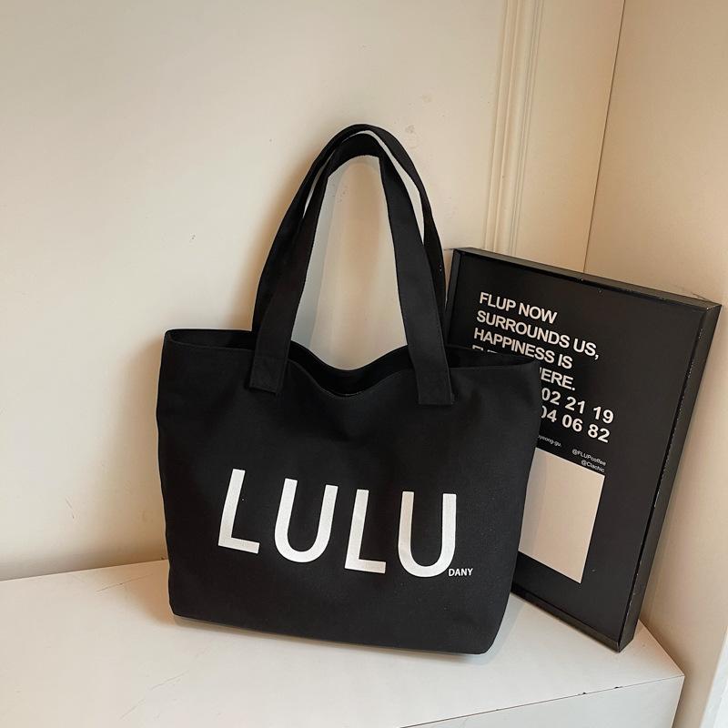 2025 autumn new portable shoulder canvas bag fashionable simple letter trend commuter large capacity shoulder bag