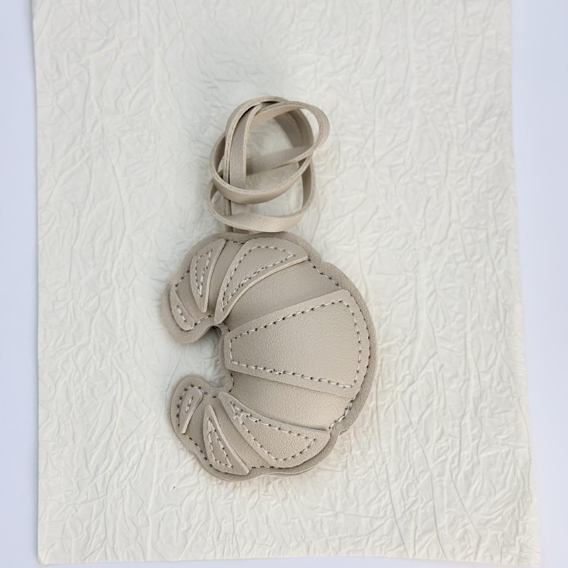 

Cross-border simulated leather leather handmade croissant bag buckle pendant pendant handmade bag pendant factory wholesale