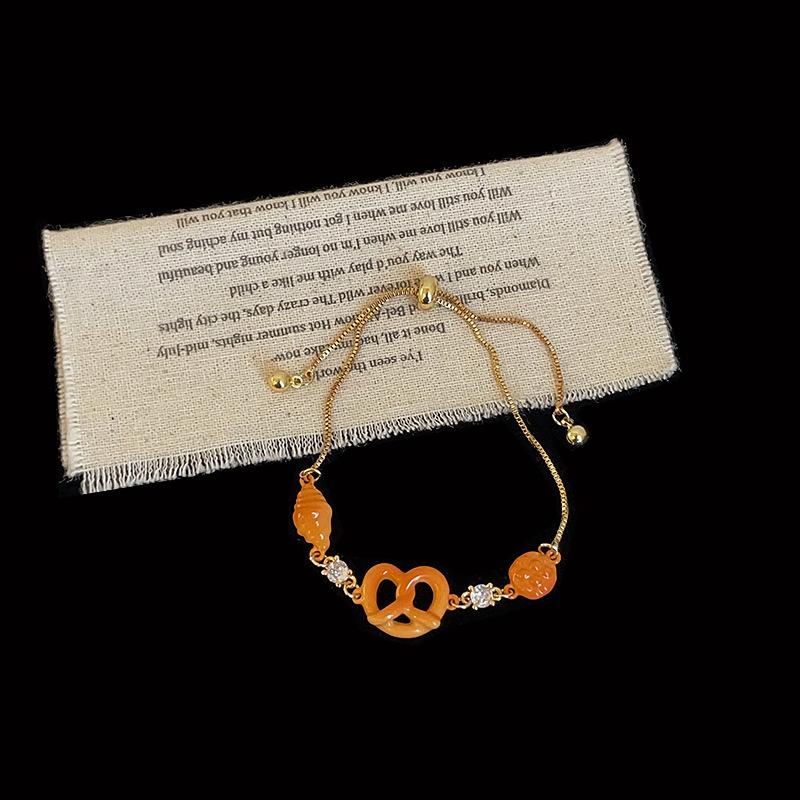 

Милая сумка-круассан, сумка-ананас, браслет-качалка с щелочной водой, нишевый женский дизайн, модные и универсальные браслеты