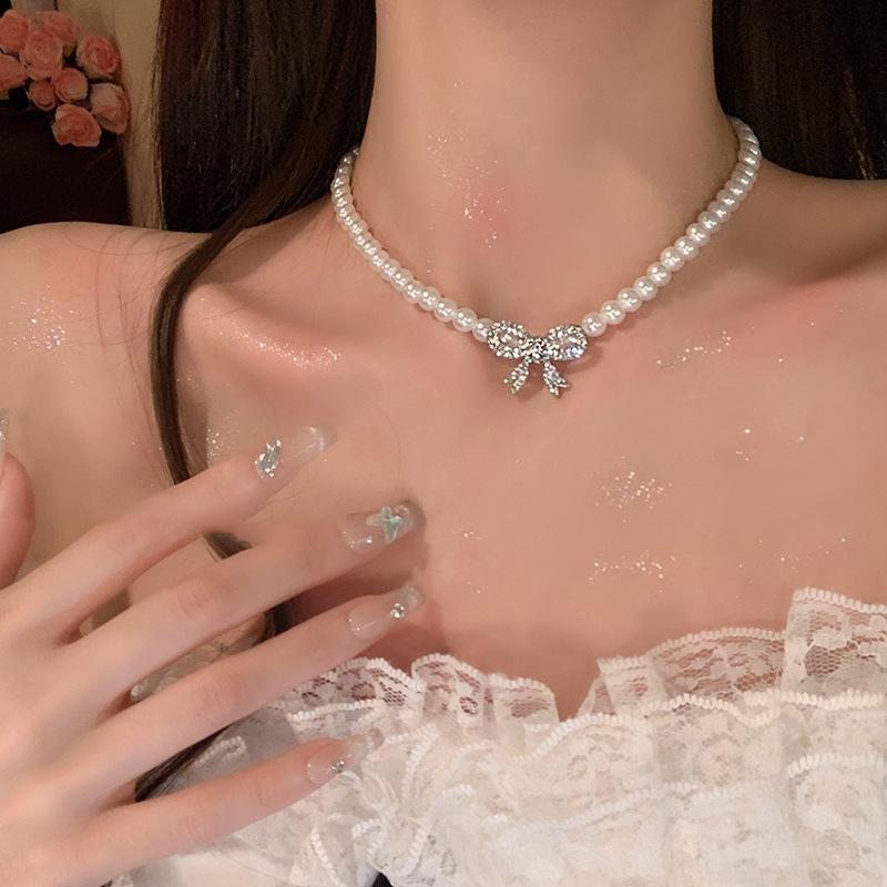 French temperament pearl necklace women's 2025 new diamond-encrusted bow collarbone chain light luxury high-end dress accessories