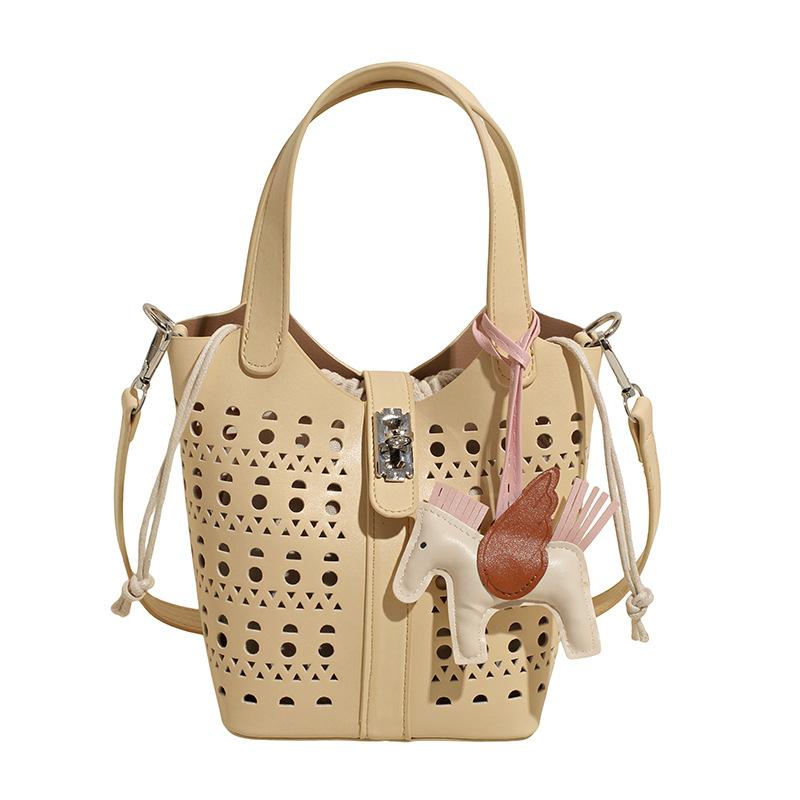 

Niche retro portable bucket bag women s new summer hollow beach vacation casual shoulder messenger bag жёлтый