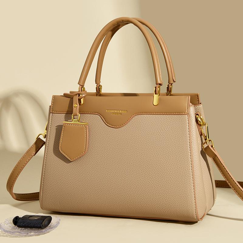 Neue minimalistische und vielseitige Damen-Handtasche mit großem Fassungsvermögen und hochwertigem Gefühl für den täglichen Weg zur Arbeit. Schultertasche kann schräg getragen werden